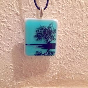 Beautiful necklace with tree pendant.